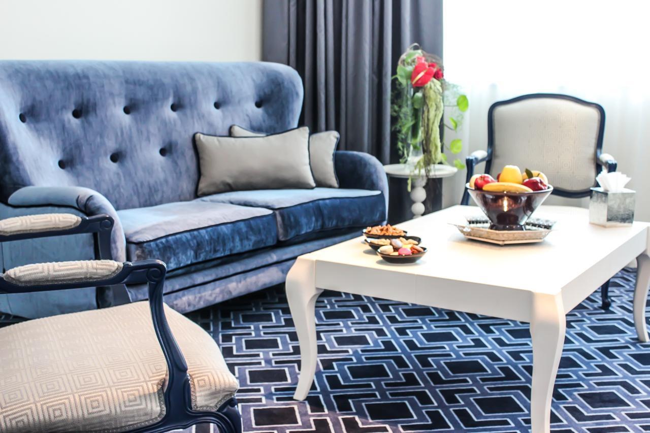 Grand Mogador City Center Casablanca Exterior photo A living room in a hotel suite