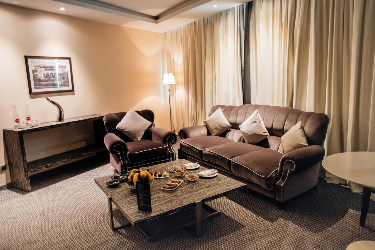 Grand Mogador City Center Casablanca Exterior photo A living room in a suite at the hotel